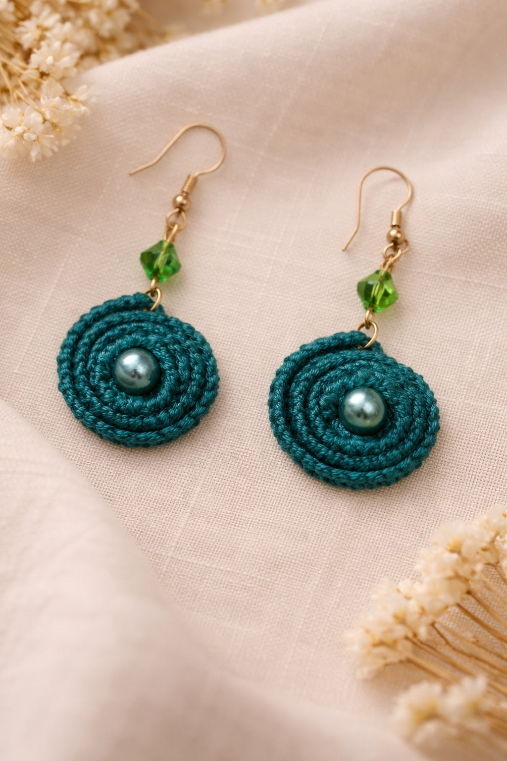Green twirl crochet earrings with green bead