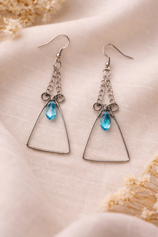 Silver Wire earrings with blue topaz color bead